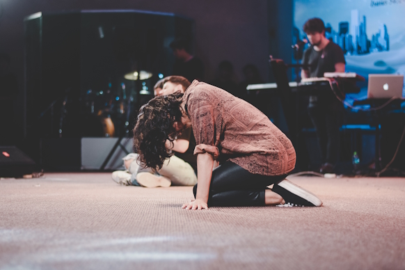 Woman kneeling in worship